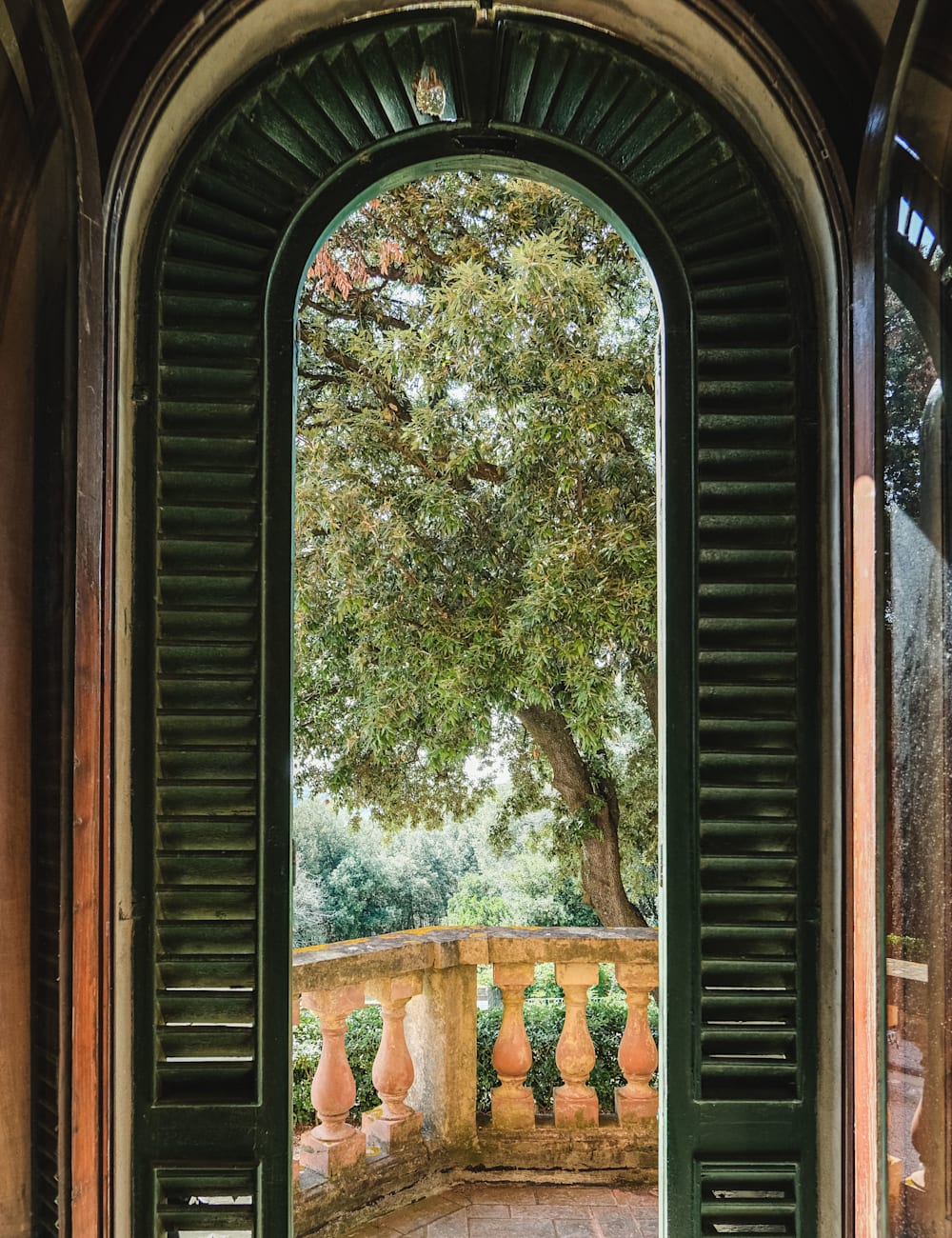 View of trees through an archway at Villa Lena hotel, Tuscany | by Michaela Watkinson for Mr & Mrs Smith