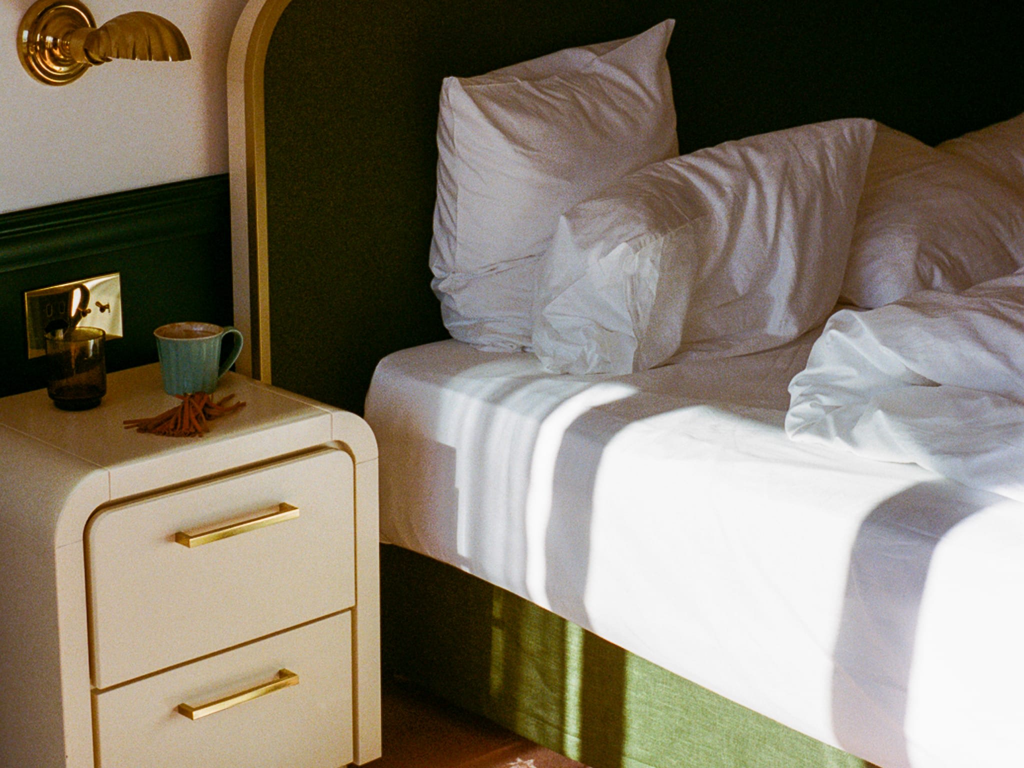 sunlit hotel room bed