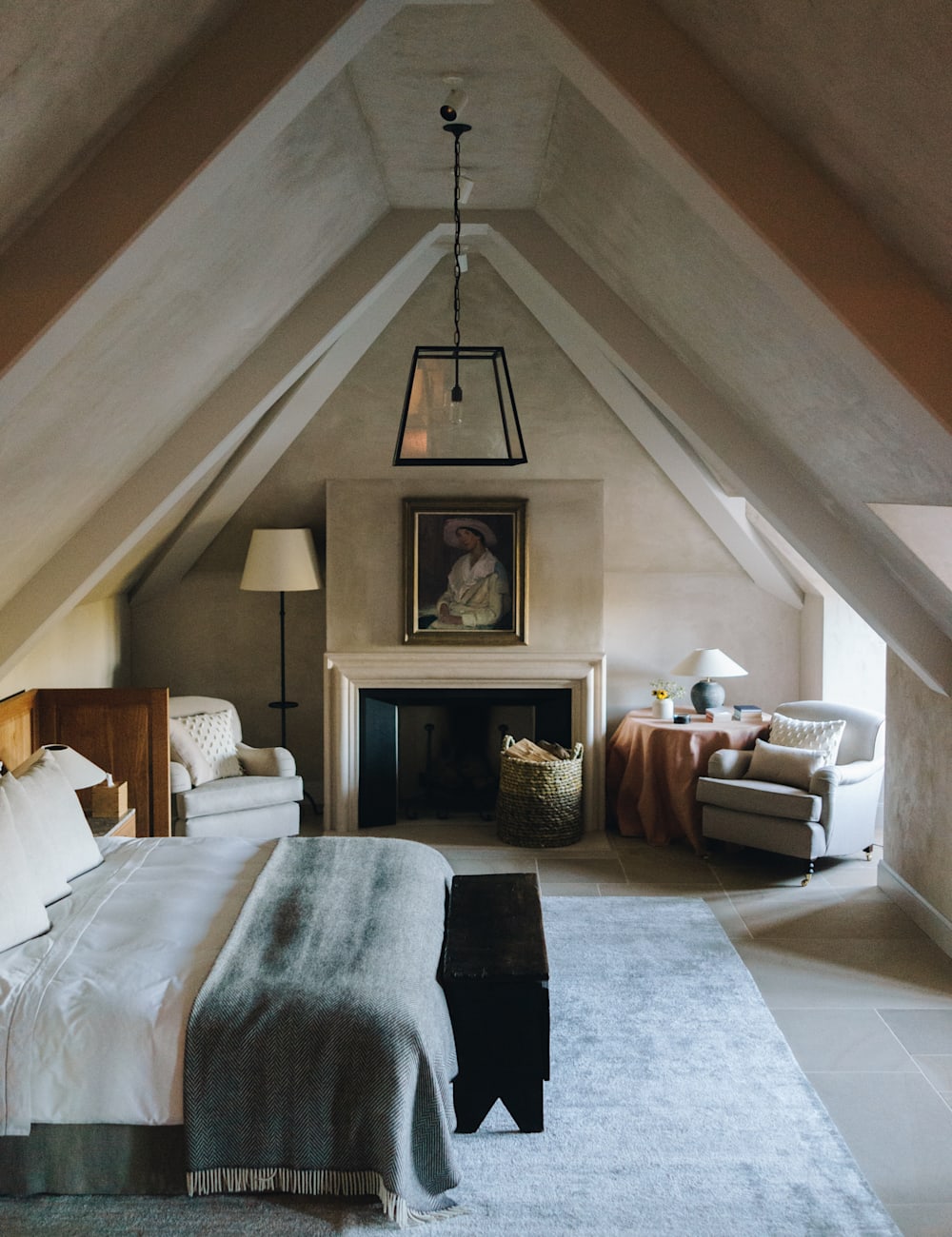 Bedroom with high ceiling and arm chair