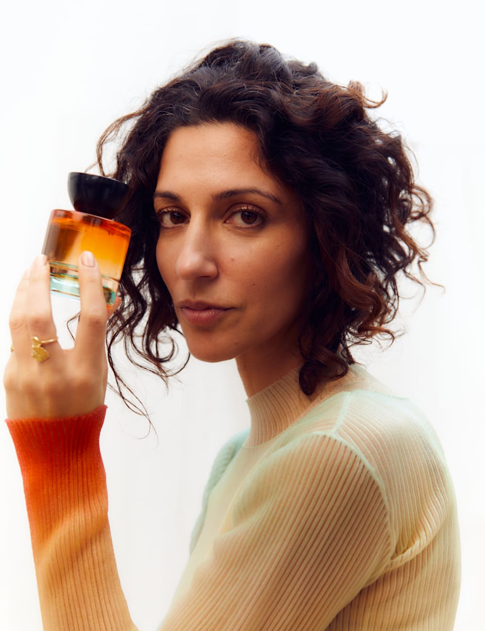 Vyrao founder Yasmin Sewell with fragrance bottle