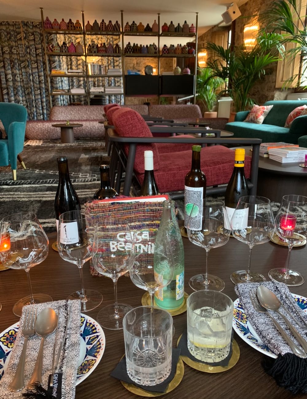 Dining table with wine glasses at Casa Beatnik hotel