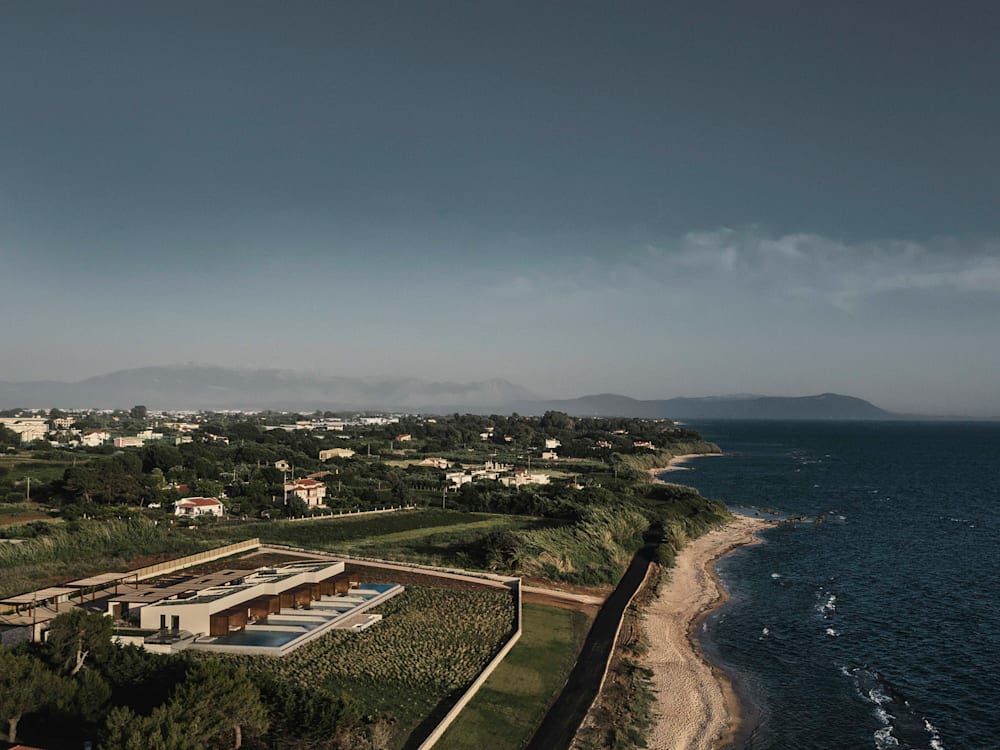 Aerial hotel exterior with the beach and the sea