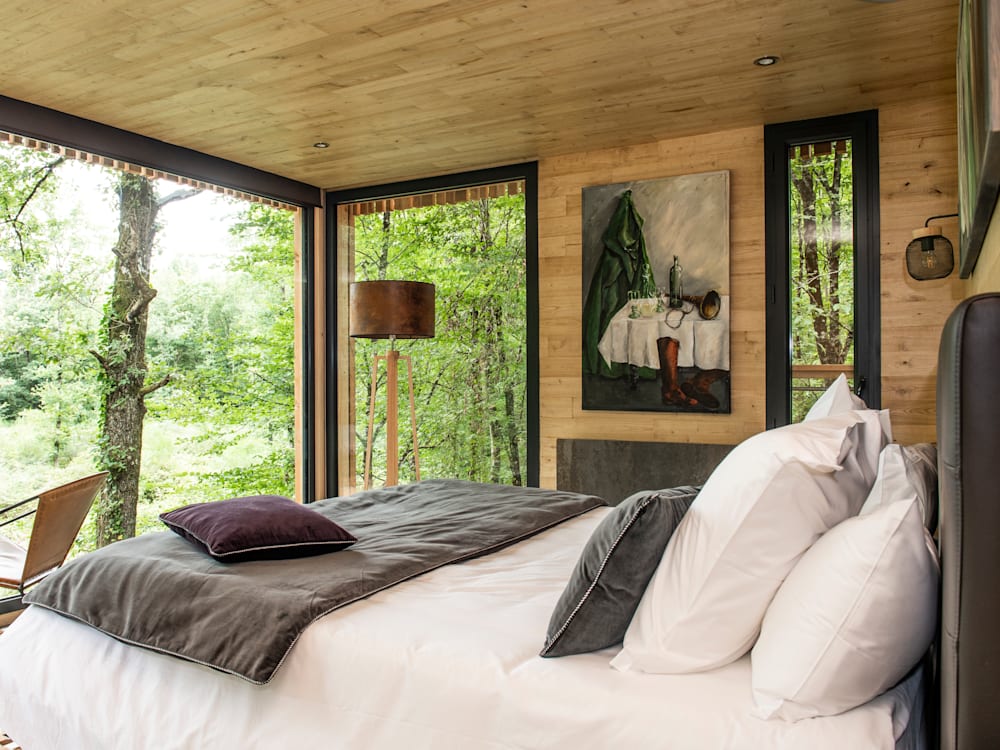 Forest-view bedroom at Loire Valley Lodges hotel