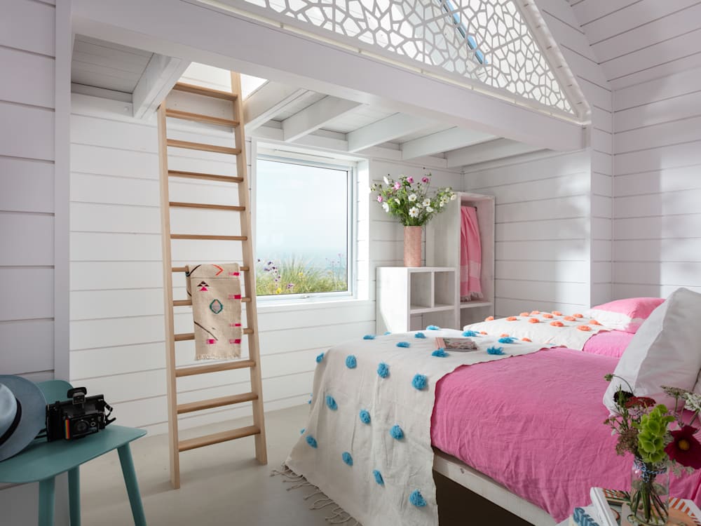 Three Mile Beach bedroom with pink bed sheets and ladder design