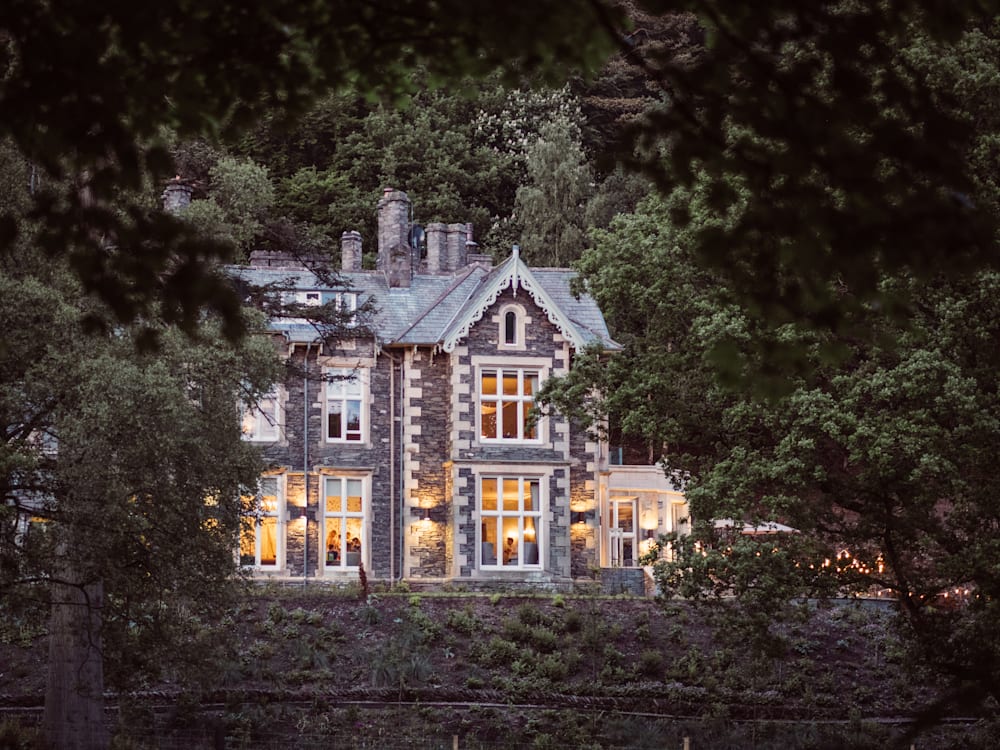 Hotel nestled in amongst the trees in the evening light