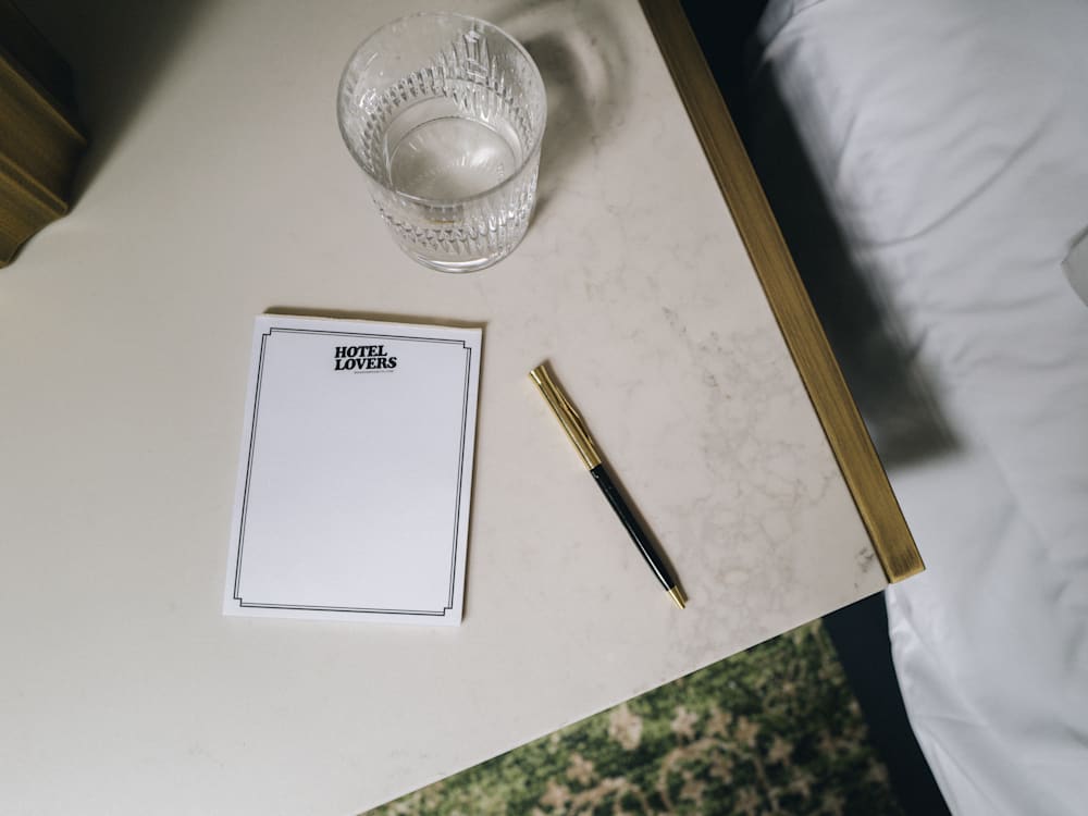 Mr & Mrs Smith hotel lovers notepad on a bedside table 