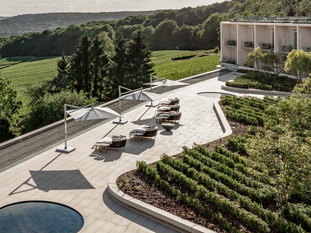 Terrace with sun loungers overlooking the vineyards