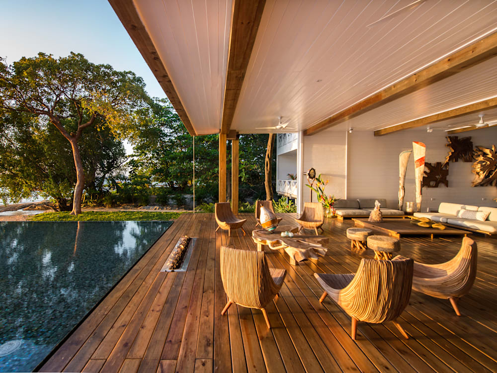 Golden hour light in the lobby lounge area leading into the swimming pool and the beach 