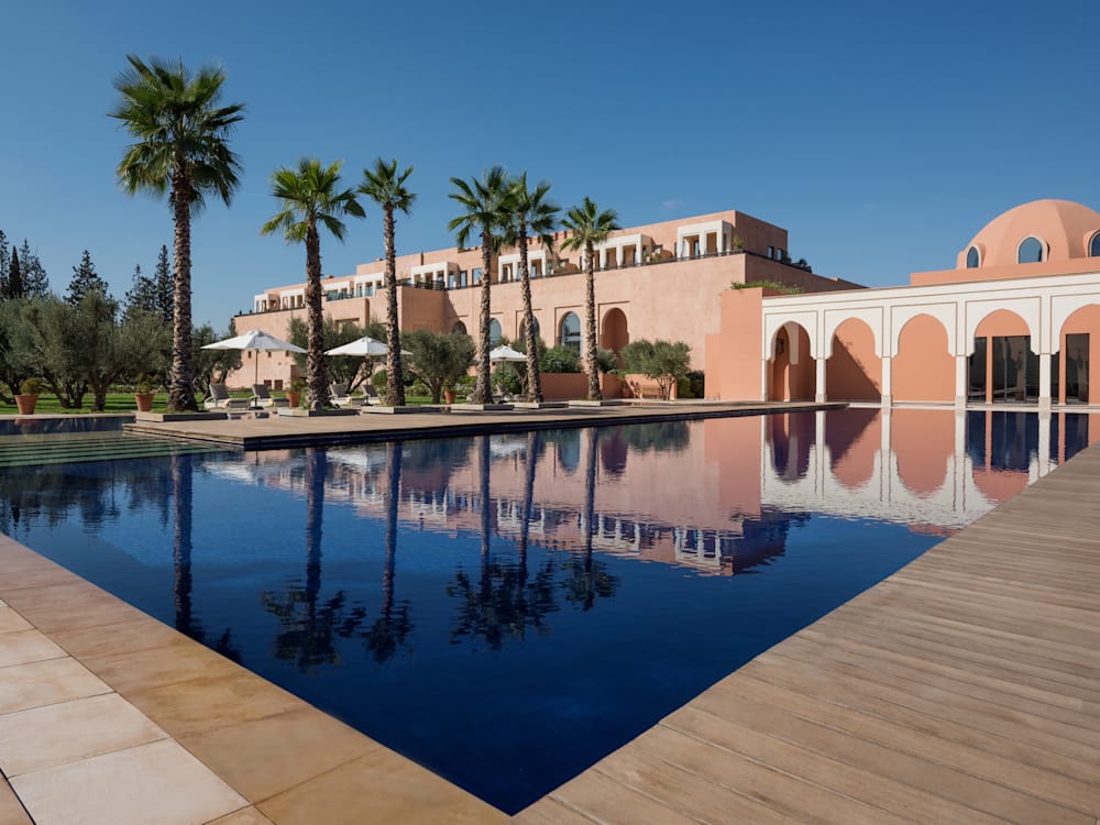 The luxurious villa with it's marble arches and deep blue swimming pool 