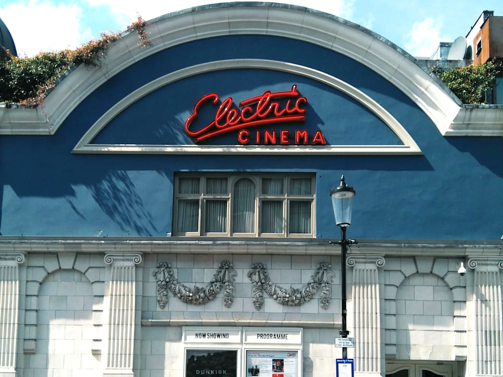 Electric Cinema on Portobello Road with neon sign and blue painted exterior