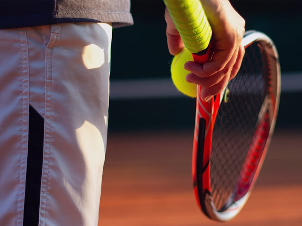Tennis racket in hand 