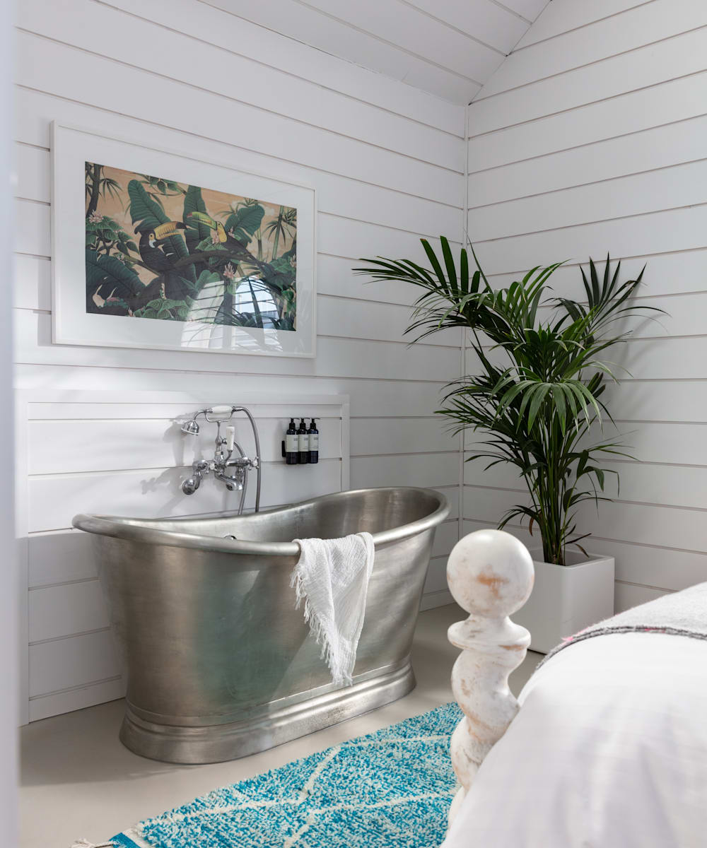 Silver bath tub and plants in boutique hotel Three Mile Beach in Cornwall