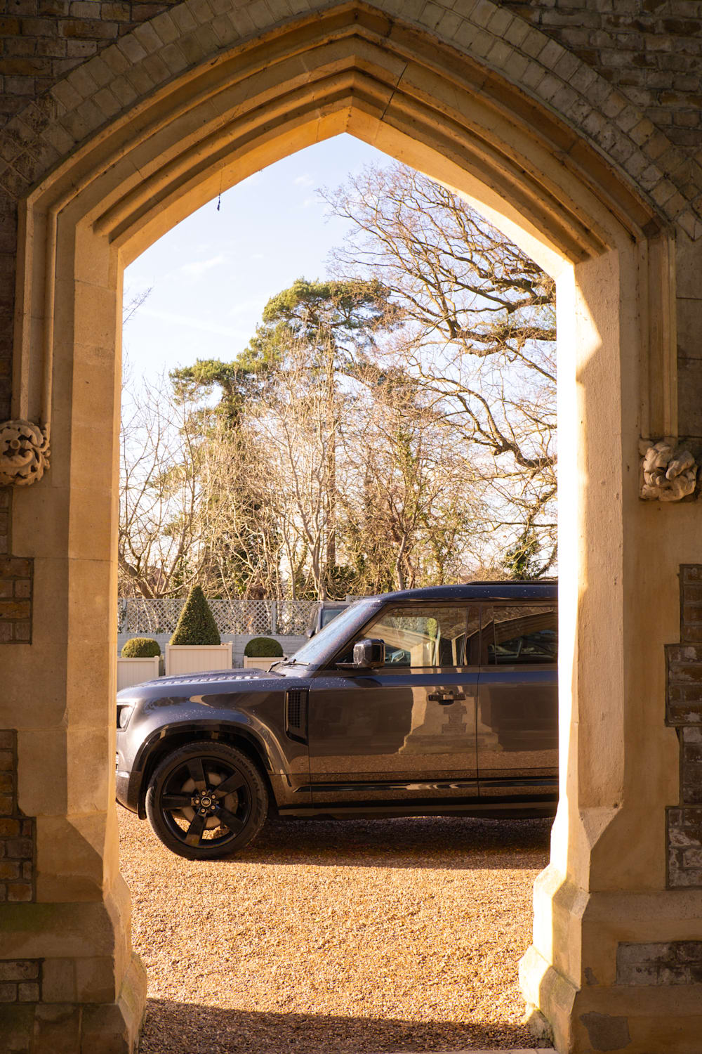 Land Rover Defender view through archway at Oakley Court