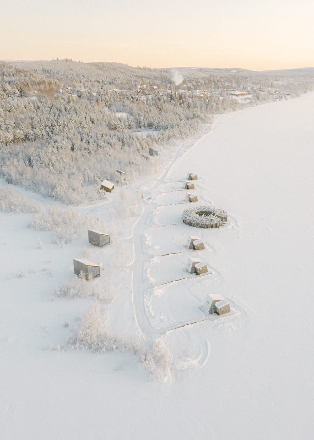 Cabins at Arctic Bath hotel in the snow