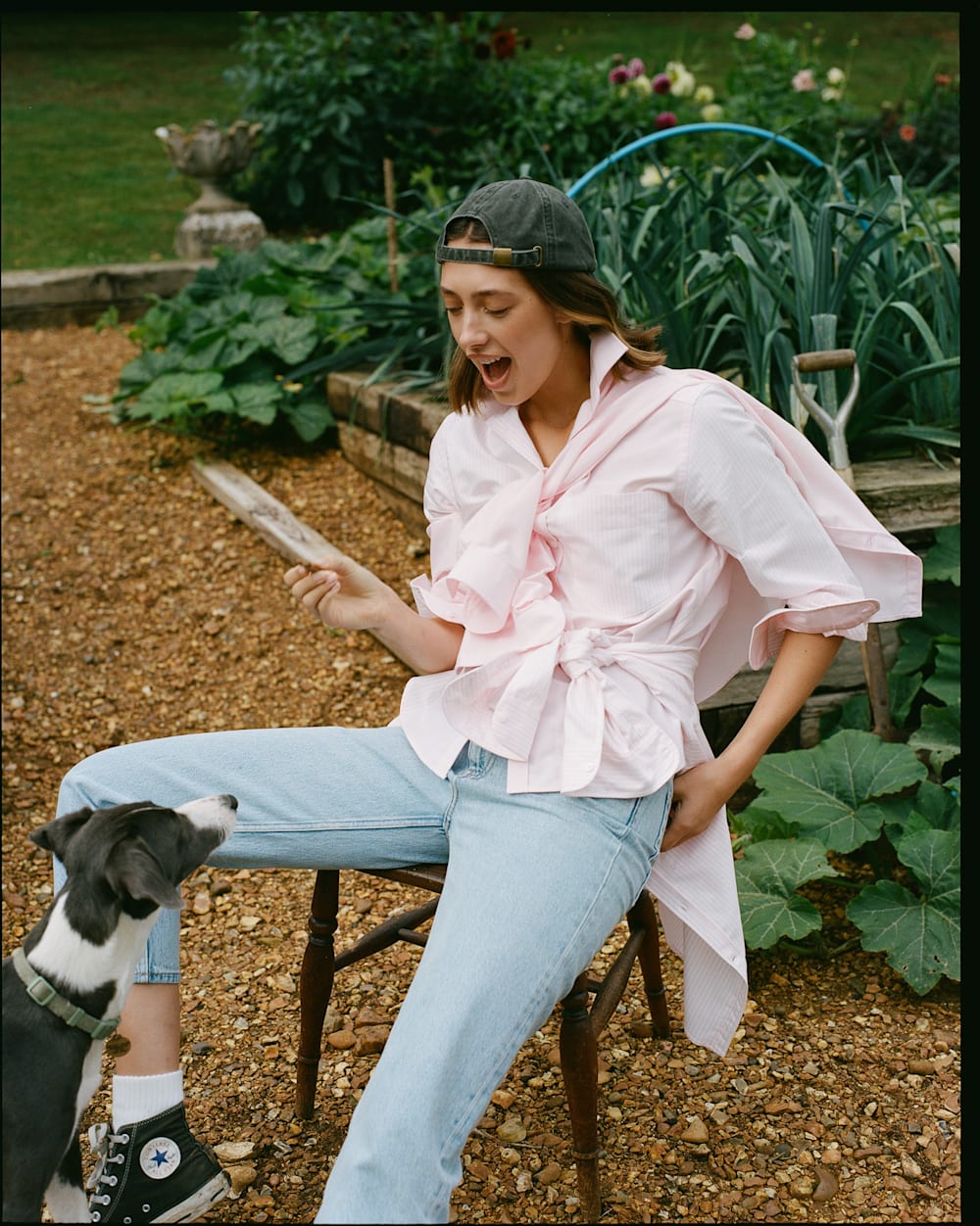 Woman in pink shirt and jeans